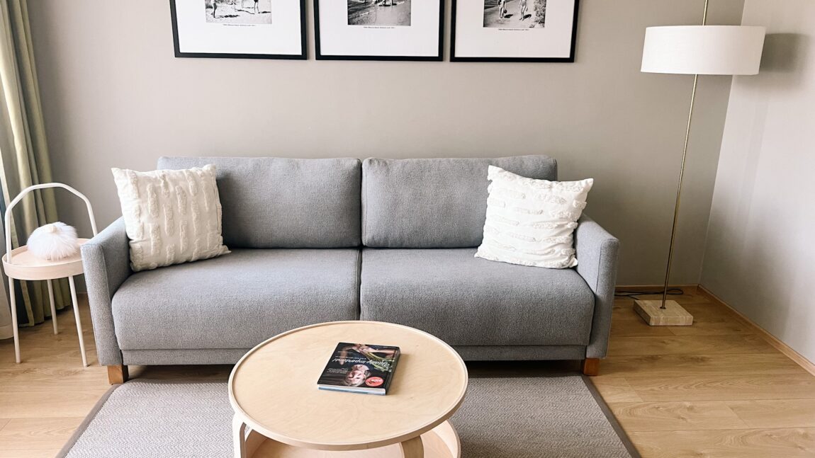 LaSpa family room with large bed, sofa bed, balcony access, soft natural light and minimalist Nordic interior
